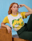 Tiara is wearing Anniversary Tee in Lemon