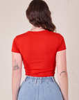 Baby Tee in Mustang Red back view on Alex