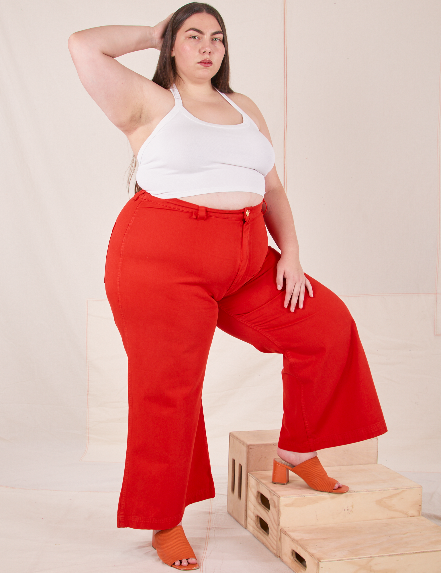 Marielena is 5&#39;8&quot; and wearing 2XL Bell Bottoms in Mustang Red paired with vintage off-white Halter Top