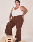 Angled view of Bell Bottoms in Fudgesicle Brown and vintage off-white Cropped Tank Top on Sam