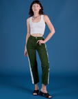 Alex is 5’8” and wearing XXS Painted Work Pants in Evergreen paired with vintage tee white Cropped Tank