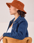 Tiara is wearing Wide Brim Denim Bucket Hats in Burnt Terracotta