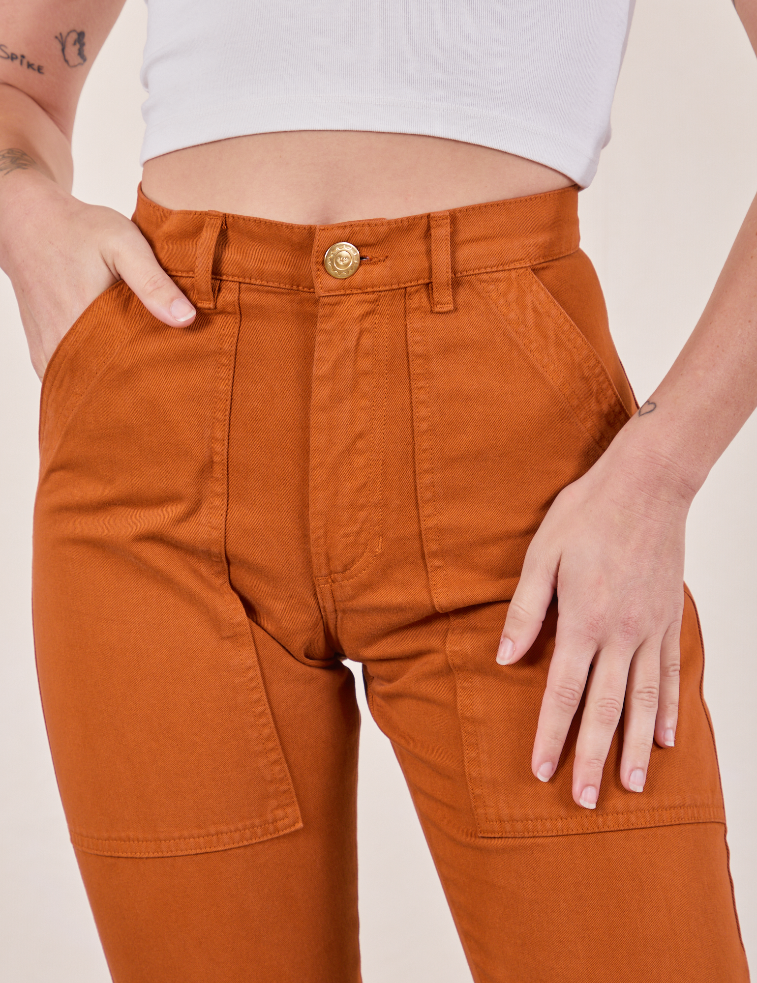 Pencil Pants in Burnt Terracotta front close up on Alex