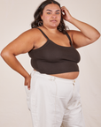 Angled view of Cropped Cami in Espresso Brown and vintage off-white Western Pants worn by Alicia