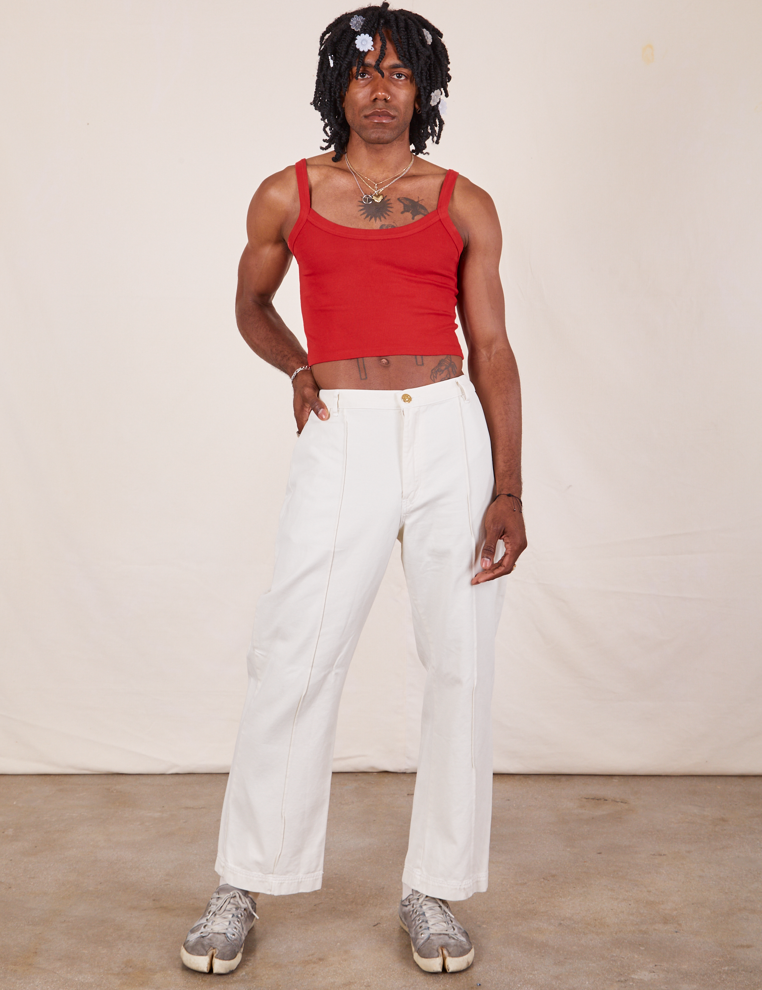 Jerrod is wearing Cropped Cami in Mustang Red and vintage tee off-white Western Pants