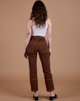 Carpenter Jeans in Fudgesicle Brown back view on Alex