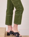 Railroad Carpenter Jeans in Summer Olive side pant leg close up on Alex