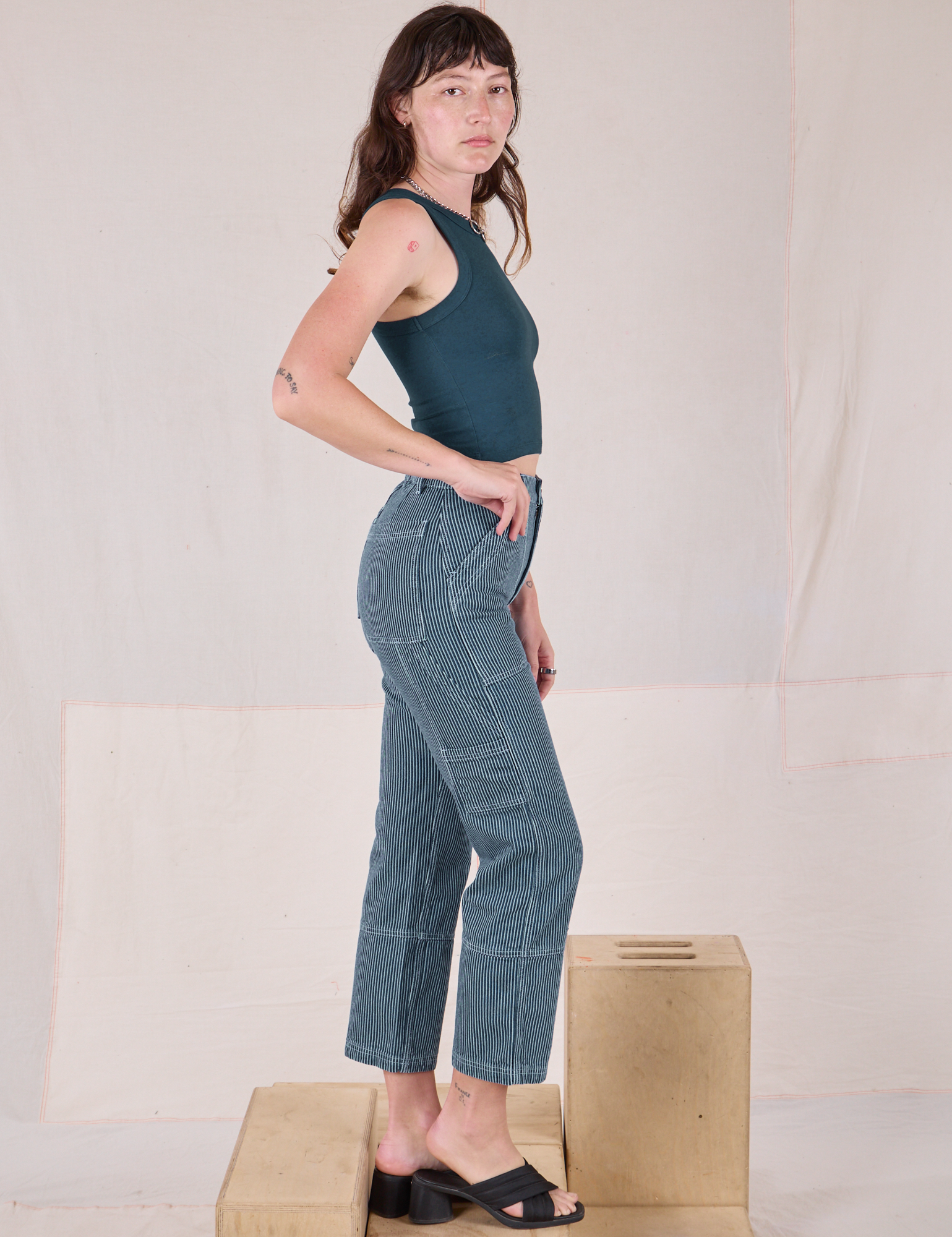Side view of Railroad Carpenter Jeans in Baby Blue and marine Muscle Tee on Alex