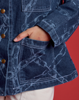 Tiara's hand in front pocket of the Chain Link Work Jacket