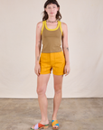 Alex is wearing Colorblock Cropped Tank in Desert Brown and mustard yellow Work Shorts