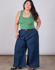 Ashley is wearing Cropped Tank Top in Seafoam Green paired with dark wash Indigo Wide Leg Trousers