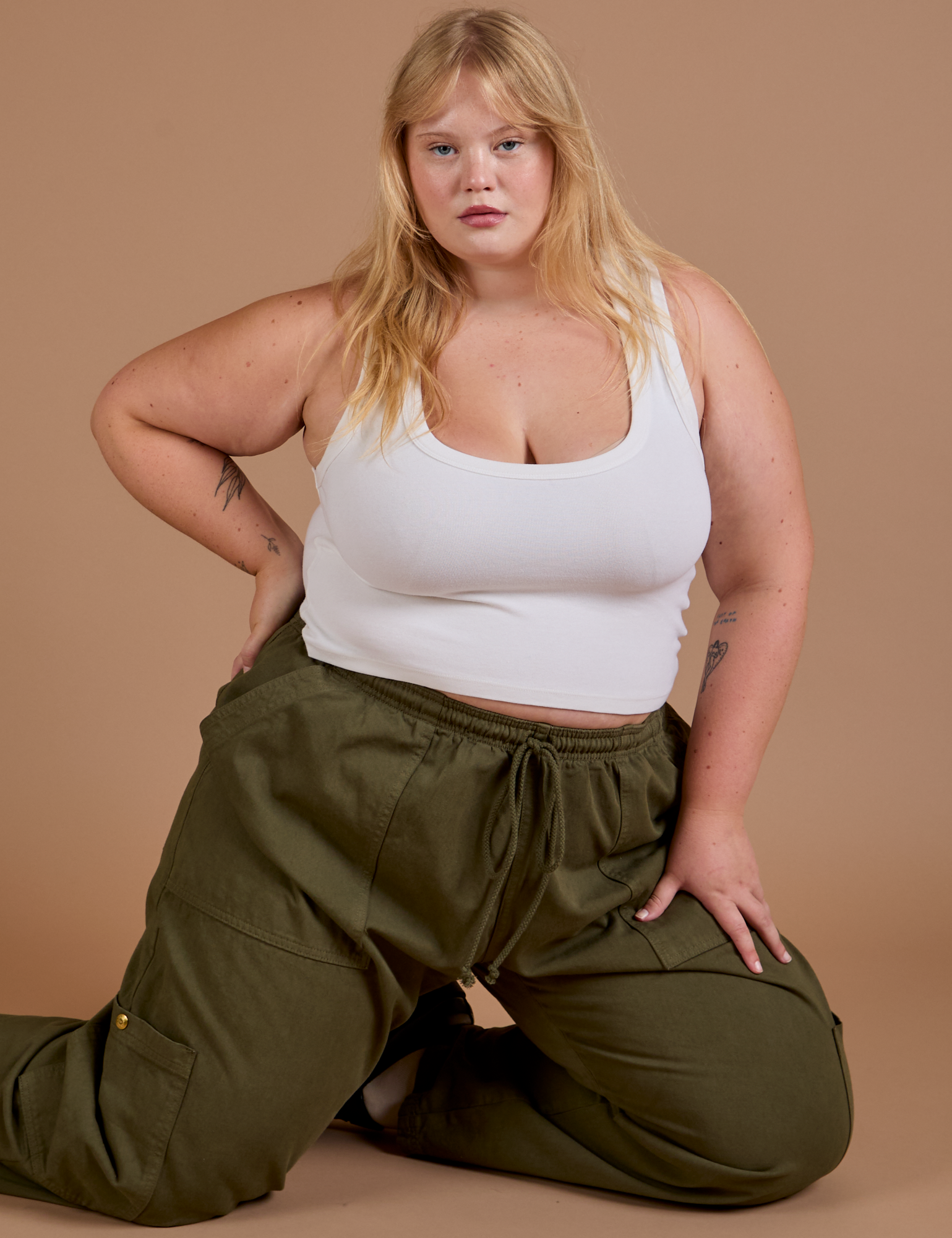 Drop Pocket Cargo Pants in Surplus Green and Cropped Tank in Vintage Tee White worn by Juliet