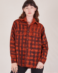 Alex is wearing Plaid Flannel Overshirt in Paprika