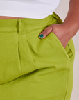 Close up of Morgan's hand in the pocket of Heavyweight Trousers in Gross Green