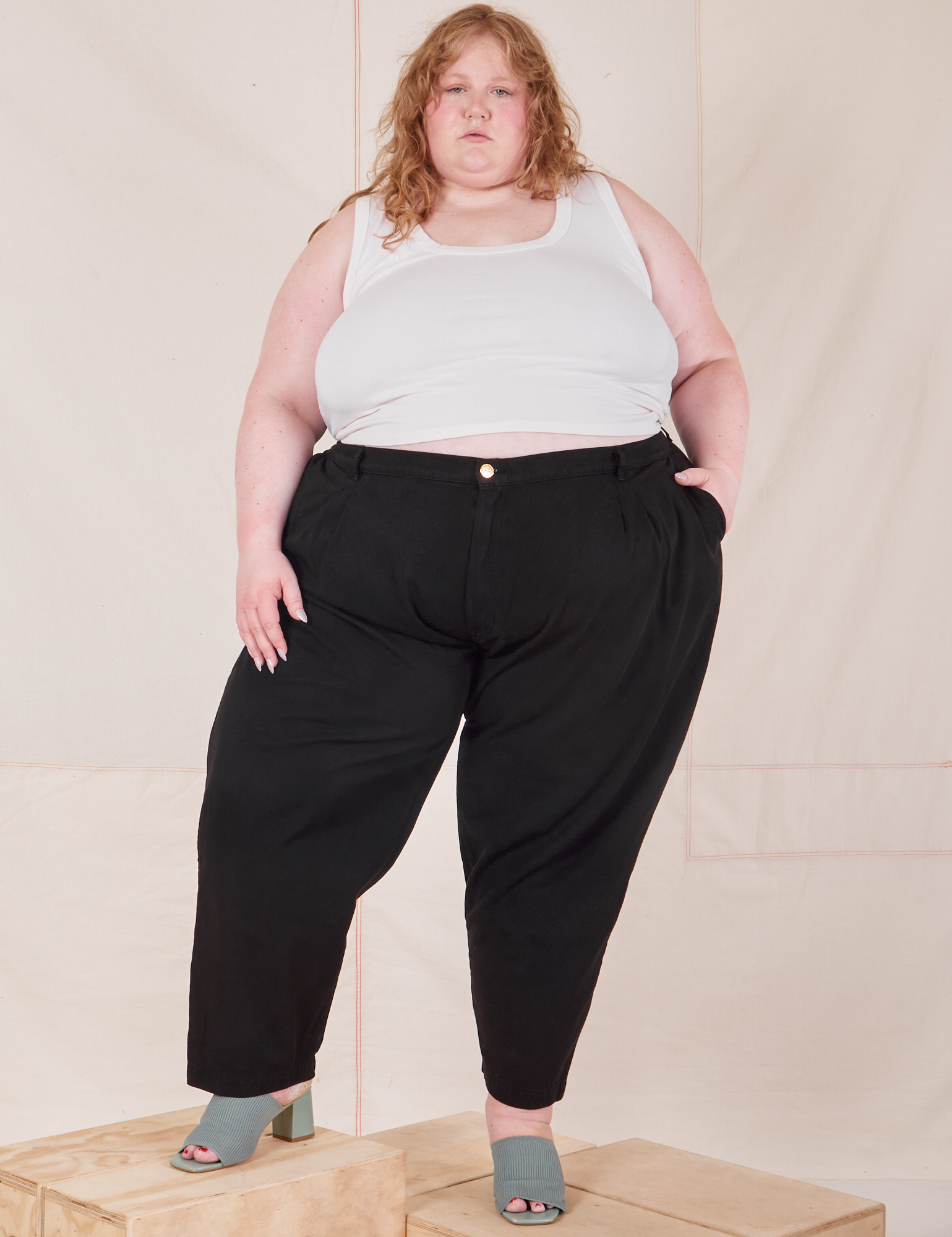 Catie is 5&#39;11&quot; and wearing 4XL Heavyweight Trousers in Basic Black paired with Cropped Tank Top in vintage tee off-white
