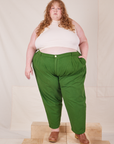 Catie is 5'11" and wearing 4XL Heavyweight Trousers in Lawn Green paired with Sleeveless Turtleneck in vintage tee off-white