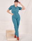Tiara is 5'4" and wearing size S Heritage Short Sleeve Jumpsuit in Marine Blue