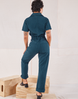 Heritage Short Sleeve Jumpsuit in Lagoon back view on Mika