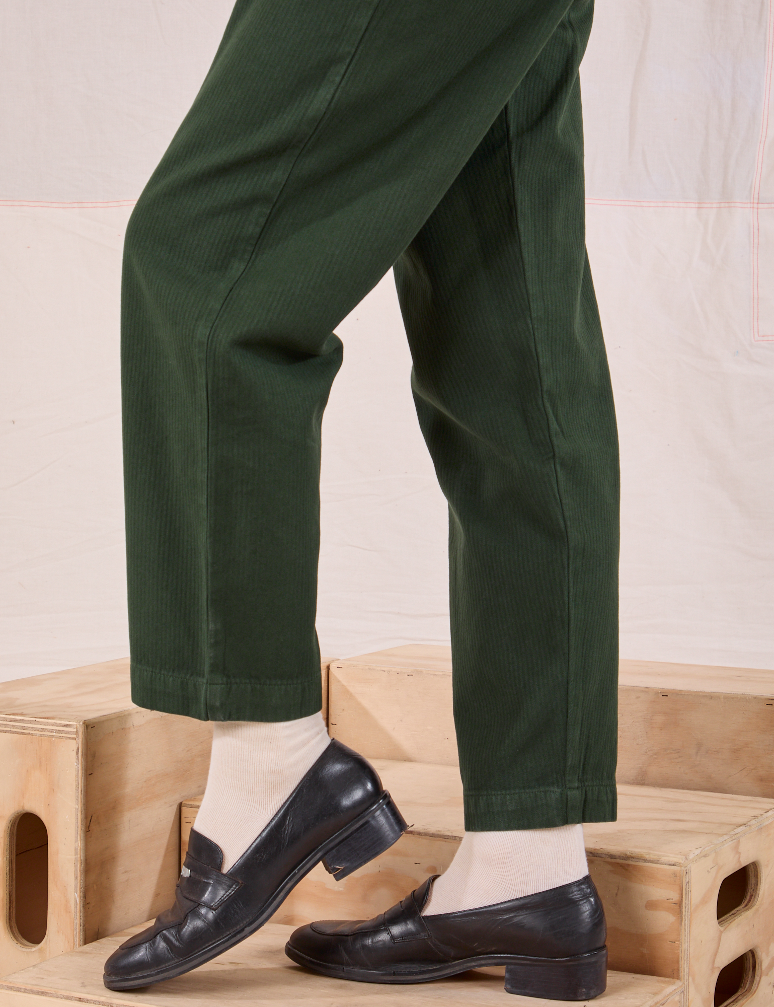 Heritage Trousers in Swamp Green pant leg close up on Alex