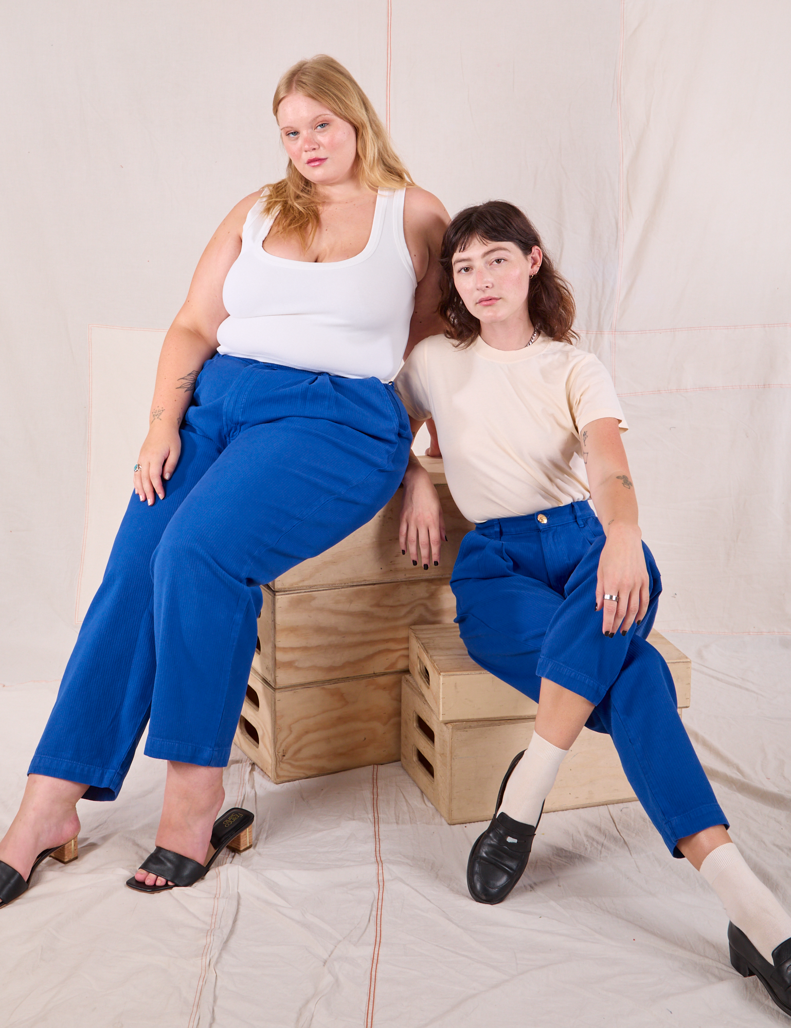 Alex and Juliet are both wearing Heritage Trousers in Royal Blue