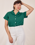 Tiara is wearing Pantry Button-Up in Hunter Green tucked into vintage tee off-white Western Pants
