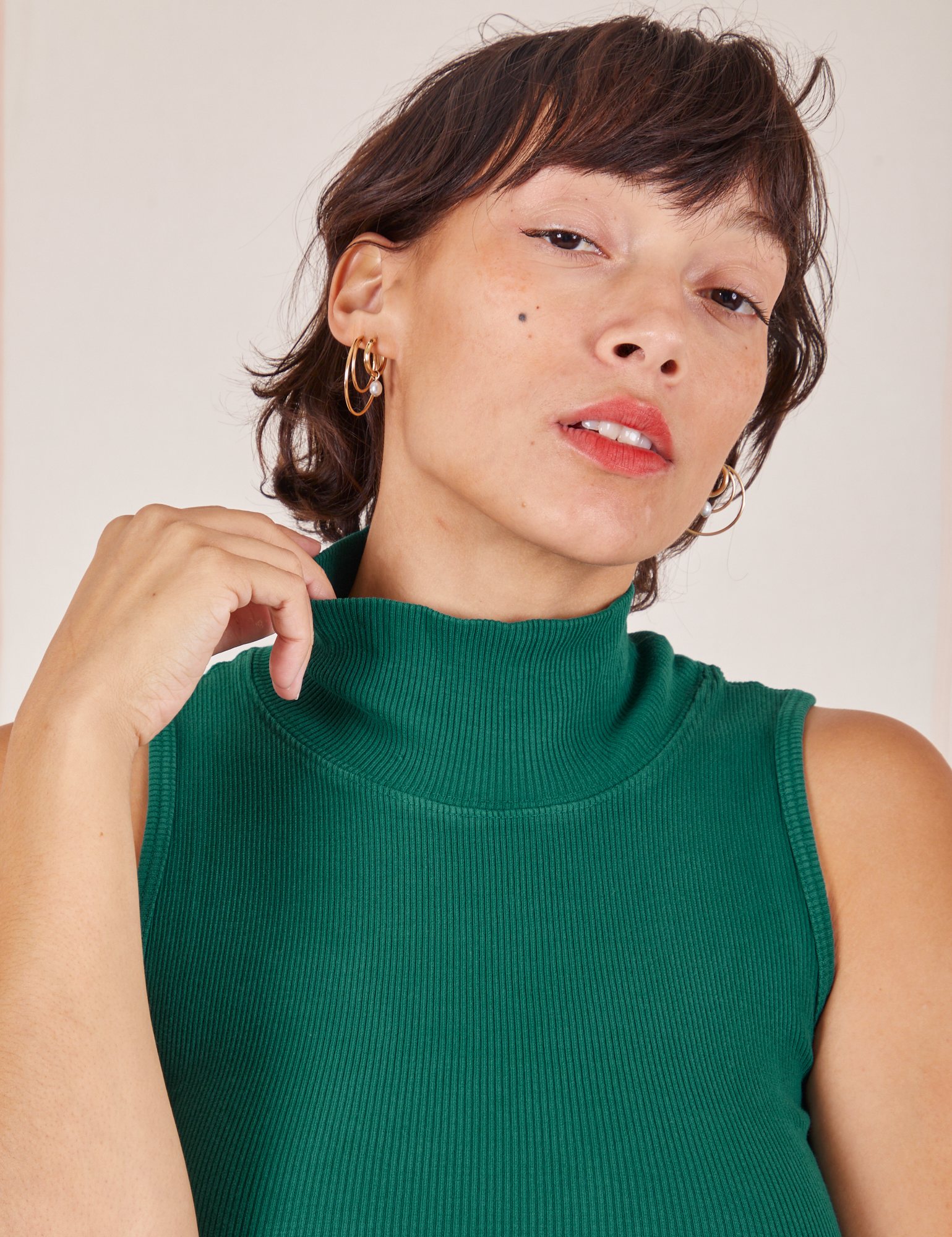 Close up of Sleeveless Essential Turtleneck in Hunter Green on Tiara