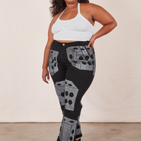 Morgan is 5'5" and wearing 1XL Icon Work Pants in Dice paired with vintage off-white Halter Top