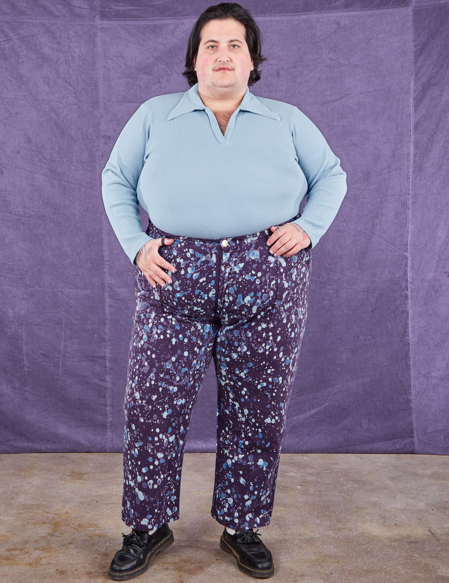 Sam is 5&#39;10&quot; and wearing 3XL Marble Splatter Work Pants in Nebula Purple paired with baby blue Long Sleeve Fisherman Polo