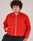 Miguel is 6’0” and wearing 1XL Mechanic Jacket in Mustang Red