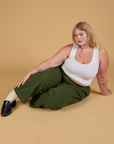 Baggy Mid-Rise Trousers in Evergreen and vintage tee white Cropped Tank worn by Juliet