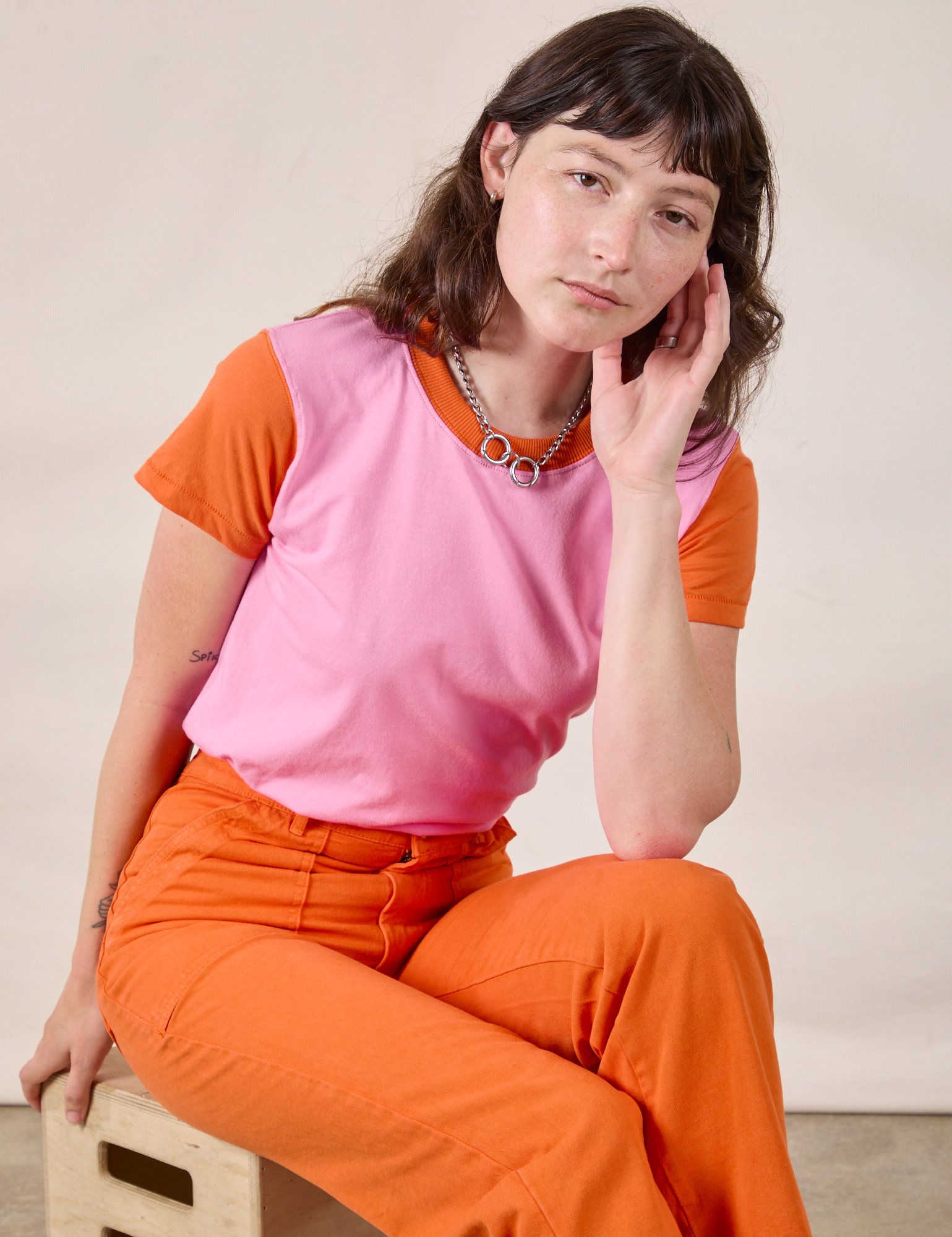 Mismatched Tee in Pink & Orange and construction orange Work Pants on Alex