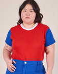 Ashley is 5’7” and wearing L Mismatched Tee in Red & Blue