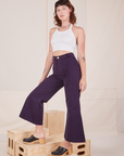 Alex is wearing Bell Bottoms in Nebula Purple and Halter Top in vintage tee off-white