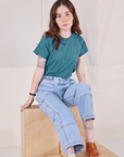 Hana is wearing Organic Vintage Tee in Marine Blue and light wash Carpenter Jeans