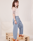 Side view of Organic Trousers in Periwinkle and Sleeveless Turtleneck in vintage tee off-white worn by Hana