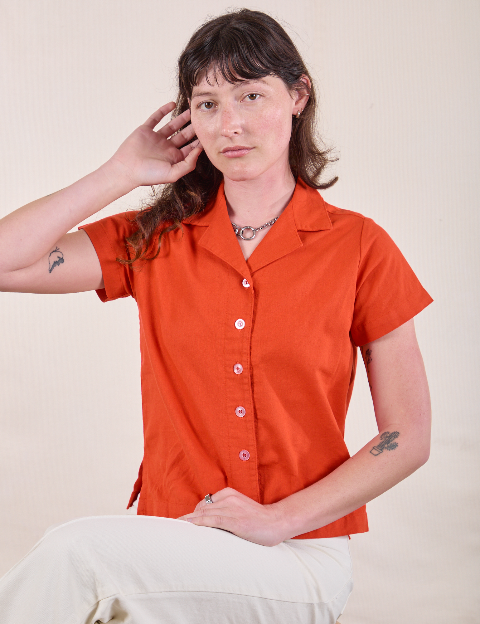 Alex is 5'8" and wearing P Pantry Button-Up in Chili Red