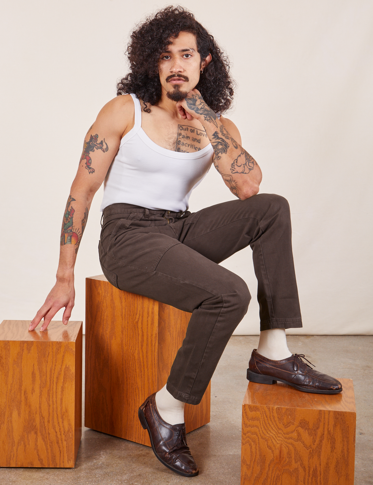 Jesse is wearing Pencil Pants in Espresso Brown and Cropped Cami in vintage tee off-white