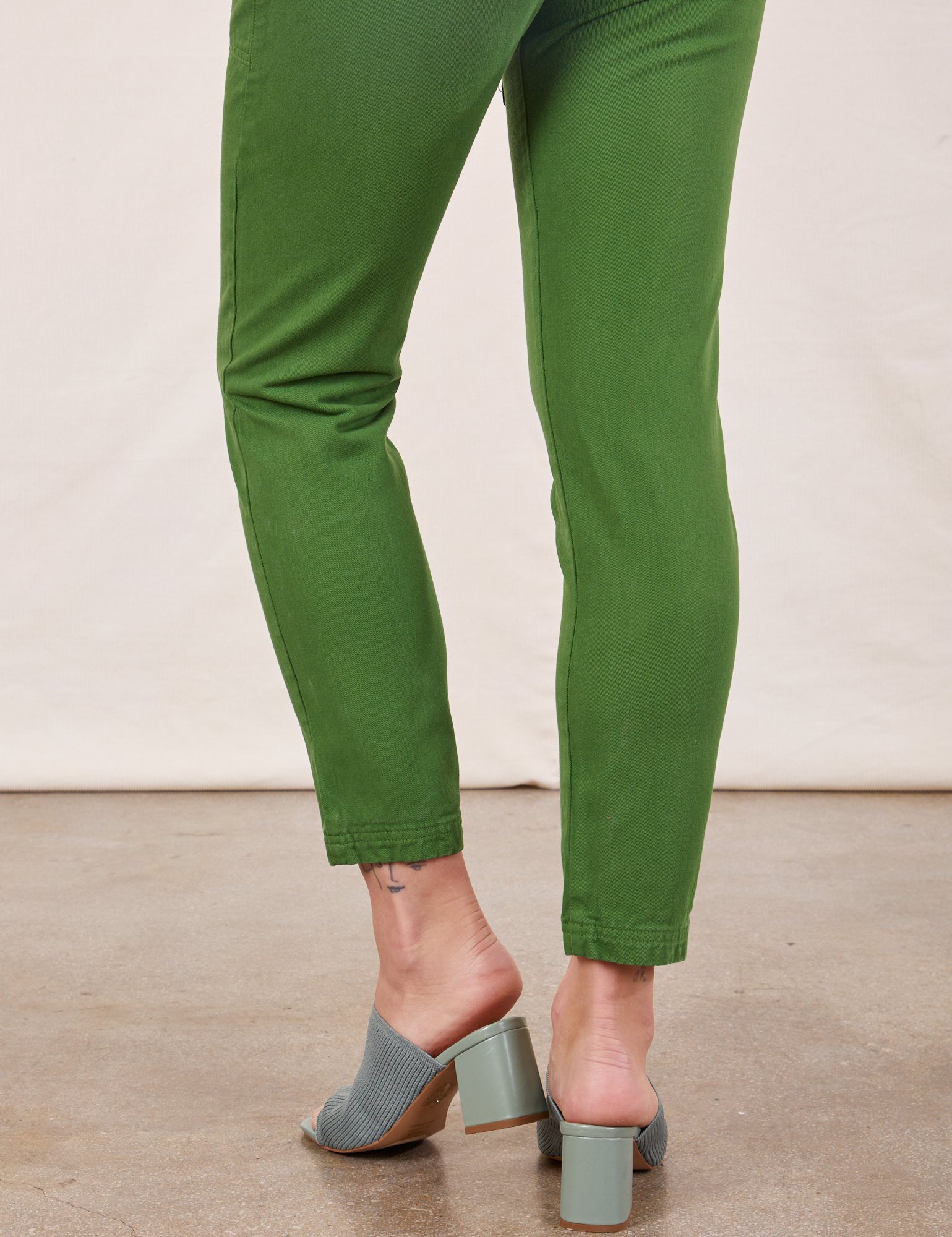 Pencil Pants in Lawn Green pant leg back view close up on Alex