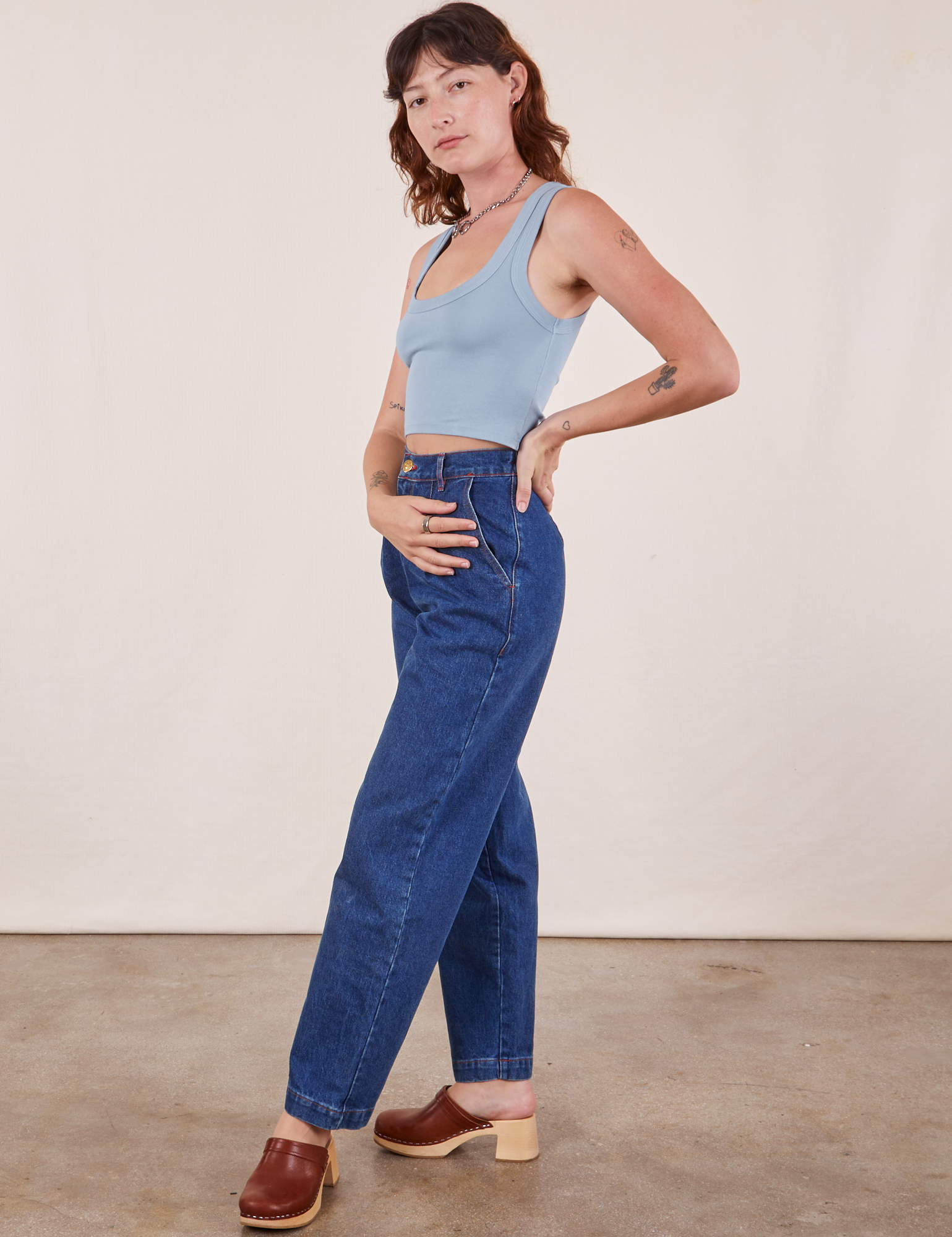 Angled front view of Cropped Tank Top in Periwinkle and dark wash Denim Trouser Jeans on Alex