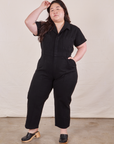 Ashley is 5’7” and wearing 1XL Petite Short Sleeve Jumpsuit in Basic Black.