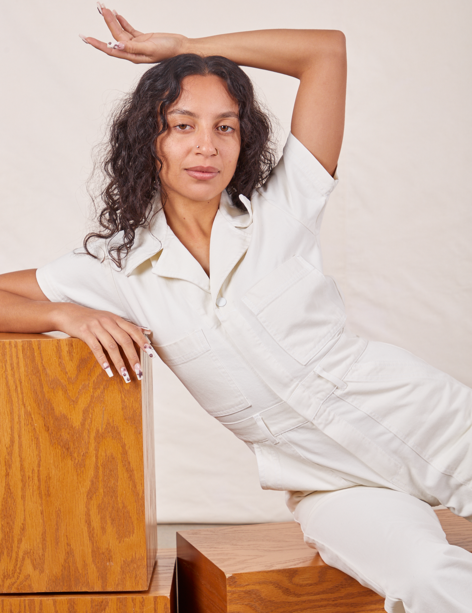Blair is wearing Petite Short Sleeve Jumpsuit in Vintage Tee Off-White