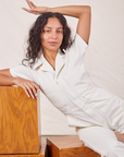 Blair is wearing Petite Short Sleeve Jumpsuit in Vintage Tee Off-White