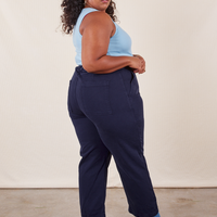 Work Pants in Navy Blue back view on Morgan wearing baby blue Tank Top