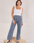 Tiara is 5'4" and wearing S Carpenter Jeans in Indigo Railroad paired with vintage tee off-white Square Neck Tank