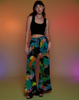 Alex is 5’8” and wearing P Tie Dyed Wide Leg Sweat Pants paired with a black Cropped Tank