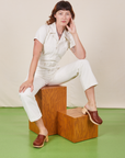 Alex is wearing Short Sleeve Jumpsuit in Vintage Tee Off-White