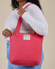 Over-Shoulder Zip Mini Tote in Hot Pink worn on shoulder of model