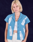 Madeline is 5'9" and wearing P Soda Bottle Pantry Button-Up in Greek Blue