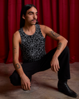 Anthony is wearing Spider Webs Racerback Tank and Work Pants in Black