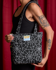Spider Webs Printed Shoulder Zip Tote worn over shoulder